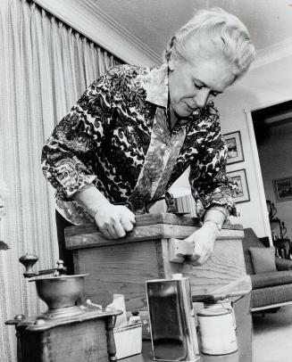 Dr. Henrietta Banting at work. She's finishing an antique for her Quebec home