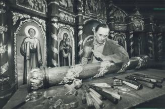 Dying art: Fourth-generation woodcarver Barac of North York puts a lot of work into creations such as this wooden altar. While he gets a great deal of joy out of his work, he is also saddened by the fact that his craft is drying. The native of Yugoslavia has spent 14 months carving this altar, which will sit in a church in Yorkton, Sask.