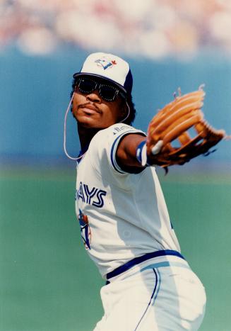 Dig those shades: Outfielder Jesse Barfield is the picture of elegance in sunglasses given him by a fan but, in case you're wondering, no, he did not wear them in the game despite the pose