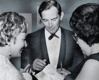 Mrs. F. A. Dunsworth, Halifax, left, and Mrs. S. W. Baker from Vancouver, wanted and got South Africa's Dr. Christiaan Barnard's autograph at last nig(...)