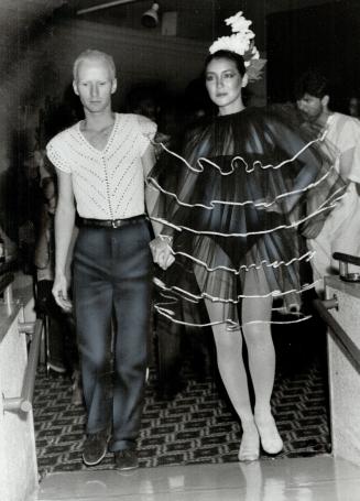 After the show: Leighton Barrett takes his bows with net-clad model, right, after Monday night's show, which drew 300 fans to Cactus restaurant
