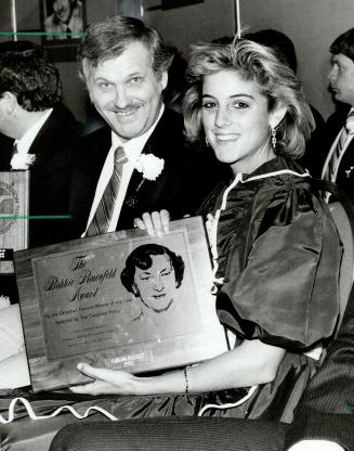 Below, champions meet as tennis star Carling Bassett, Canada's top female athlete of 1983, smiles with curling kind Ed Werenich