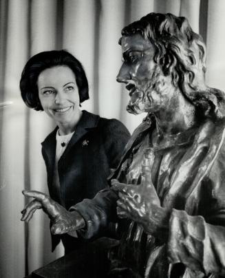 A treasure from Europe, Mrs. Thomas Bata admires wood sculpture of Salvator Mundi by Brokoff the Younger, a Czechoslovakian artist of the 1710-30 peri(...)