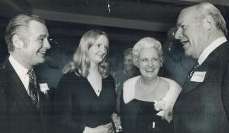 Anesthetist Dr. Cyril Kincaide talks with Mrs. Pat Hathway (centre) and her daughter Nancy at a party to raise money for a blood-gas analyser-the firs(...)