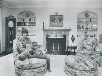 Mrs. Warren Beasley With Shane, 2, And Warren, 4, Living-room walls are a soft green and the rug is white