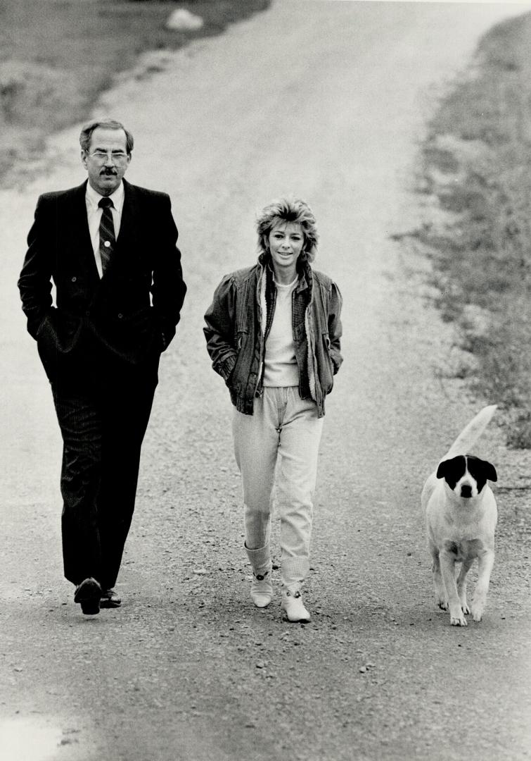 Detective William Dear and Diane Beckon discuss the case as they walk the family dog