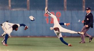 Could have been disastrous: A somersaulting George Bell missed serious injury on this play in '85 when he collided with shortstop Tony Fernandez while both were going for a popup in short left field