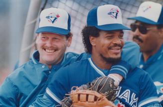 Miles of smiles: George Bell, above right, who disrupted spring training last year with his complaints about being made a designated hitter, and Ernie Whitt show off the new Blue Jay attitude