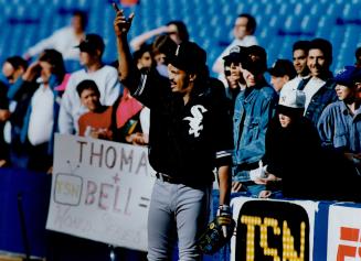 Heeee's B-a-a-c-k: George Bell, now a White Sox player, waves cheerfully before last night's game against the Blue Jays in the SkyDome