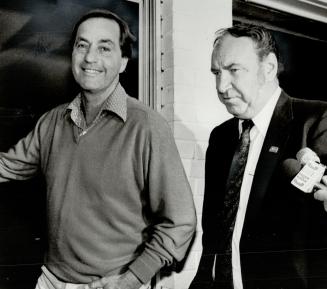 Strike is over: A smiling B.C. Premier Bill Bennett and thoughtful union negotiator Jack Munro step onto the patio of Bennett's Kelowna home to annouc(...)