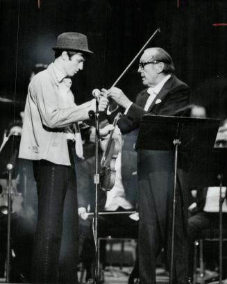 A Stagehand tried out comedian Jack Benny's violin in concert at Masssey Hall last night and managed to make it sound better, says music critic William Littler