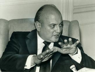 Explaining things, Finance Minister Edgar Benson gestures as he tells newsmen he has called a meeting of the Group of Ten nations to discuss trade problems
