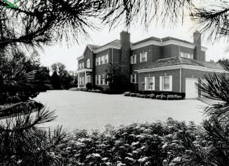 Image shows a two storey residential house.