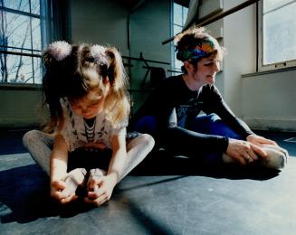 Ballet dancer Victoria Bertram and daughter Cybele do a stretching exercise at the King St