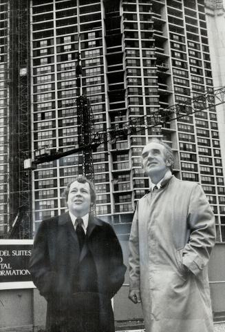 Star writer Michael Best, right, talks with Mayor Crombie in front of the Harbour Square development on Front St