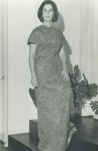 Dr. Lita-Rose Betcherman, director, Ontario Women's Bureau, Department of Labor, wears simple wool print gown suited to the busy life of the achiever
