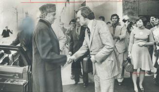 Prime minister of Pakistan, Zulfikar Ali Bhutto (left) is greeted by Toronto's acting mayor, Alderman Art Eggleton, as he arrives yesterday for a one-(...)