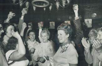 Glasses raised, supporters toast Margaret Birch, the provincial secretary for social development, at victory party last night at Maple Creek Farm. Mrs(...)