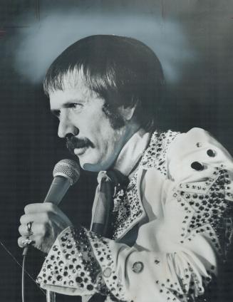 Still playing the role of the bumbling straight man, Sonny Bono last night opened for a week at the Imperial Room with a show that Star staff writer F(...)