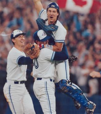 Leaps into arms of Tom Henke as John Olerud wishes to join in playoffs