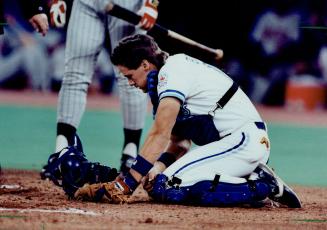 The agony: Blue Jay catcher Pat Borders wonders why he ever chose this line of work after getting hit in a tender spot by a foul tip yesterday against Minnesota