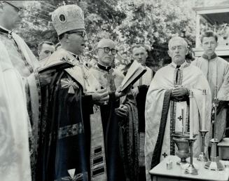 Josaphat opens, Most Rev. Isidore Borecky (centre) of the Ukrainian Catholic Church performs ceremony of blessing. Church on Franklin Ave., was opened(...)