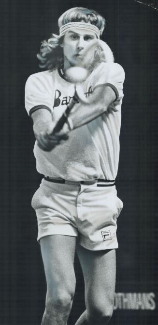 Swede star on the attack, Sweden's Bjorn Borg, latest glamor boy of the pro tennis circuit, demonstrates a two-handed forehand short during a workout (...)