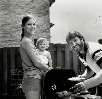 Come and get it: Bosetti feeds casserole to wife Patti, daughter Alyscia