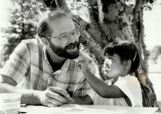 Image shows a Seven-year-old Jennifer is intrigued by a politician John Bosley's beard during a ...