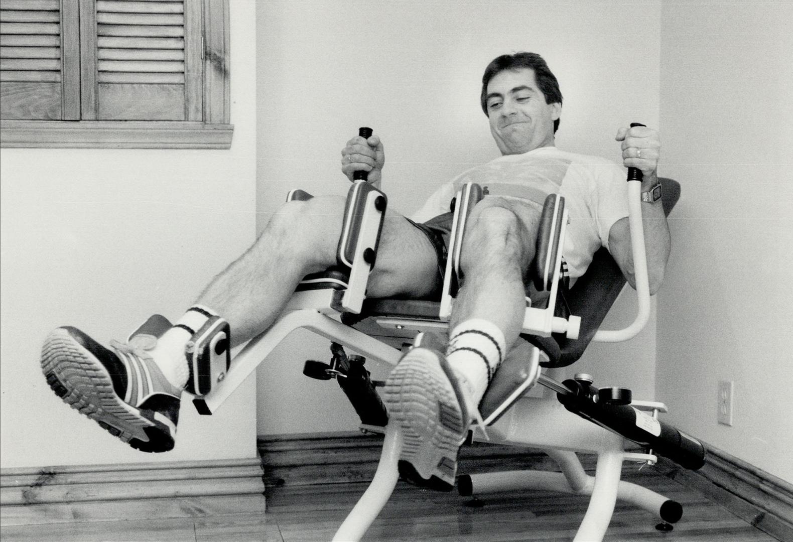At work and play: Boucher has an elaborate private gym set up in the basement of his home at Lorraine, just north of Montreal