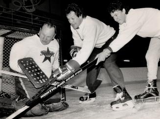 Still Making The Big Save, Former Leaf goaltender Johnny Bower stops another Leaf great, Darryl Sittler, and 16-year-old Brad Ferguson, representing the Children's Wish charity