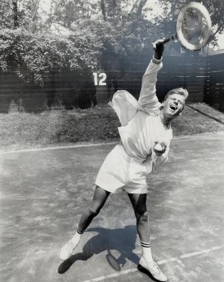 Jim Boyce of Toronto Lawn Tennis Club shows off his form while making a serve