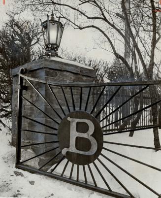 Gate to mansion of M. J. Boylen, into which gunmen burst last night to pistol-whip Boylen's son, Phil, and steal $687,500 in gems