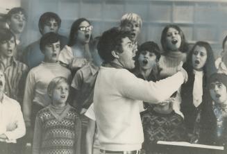 Choir singing isn't sissy business, according to Lloyd Bradshaw, chorus master of the Canadian Opera Company
