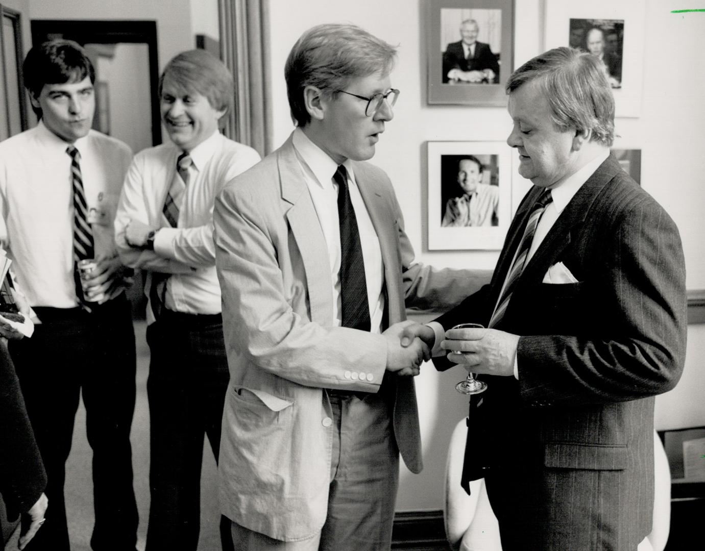 Opposition split: New democrat leader Bob Rae, left, greets Andy Brandt following the interim Tory leader's farewell news conference at Queen's Park yesterday