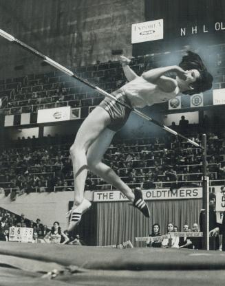Debbie Bill of Haney, B.C., hopes to win Olympic high jump title in 1972 at Munich. She demonstrates her style of going over bar backwards. Debbie's b(...)
