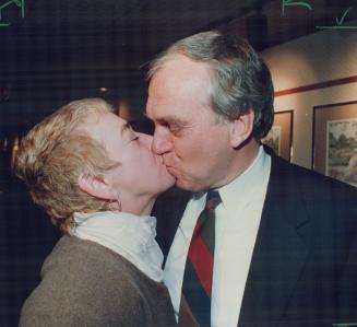 Swan song smooch: Lucille Broadbent congratulates husband Ed with a kiss yesterday shortly after he announced he was quitting as leader of the federal NDP
