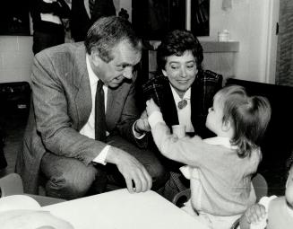 Just visiting: Lucille and Ed Broadbent play with Jenna Boriska at a Scarborough day-care centre