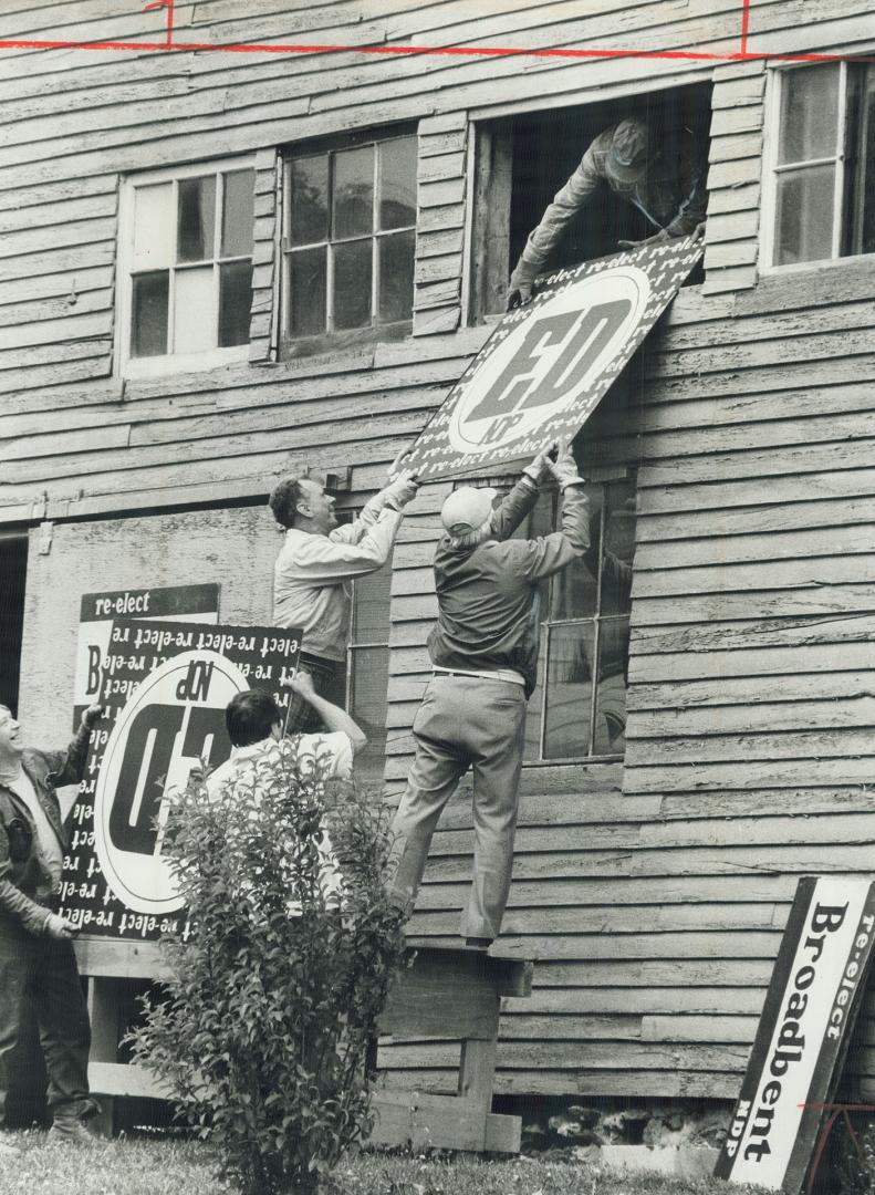 Ed Broadbent's workers store campaign signs in a barn for use in the next election