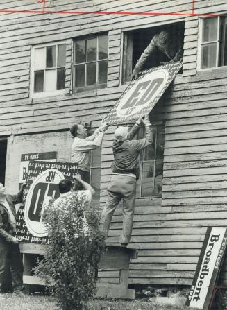 Ed Broadbent's workers store campaign signs in a barn for use in the next election