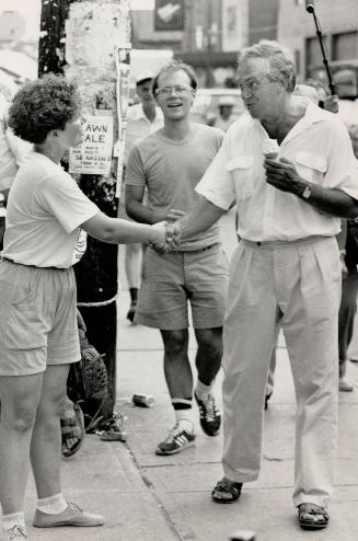 Market Pitch: New Democratic Party leader Ed Broadbent, casual in shirtsleeves and sandals, greets midday shoppers in Kensington Market yesterday