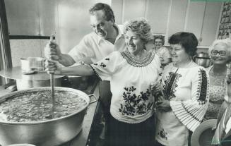 Stirring up excitement. New Democratic Party leader Ed Broadbent stirs a pot of goulash yesterday at the Budapest pavillion of Fiesta, Oshawa's multi-(...)