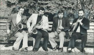 One of the few saxophone quartets in the world yesterday took advantage of the fine weather to serenade Star photographer Reg Innell. From left: John (...)