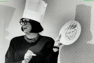 Dishing it out: Trendsetter Marilyn Brooks adopts chef pose yesterday as she graphically represents questions from luncheon audience on dinner plates
