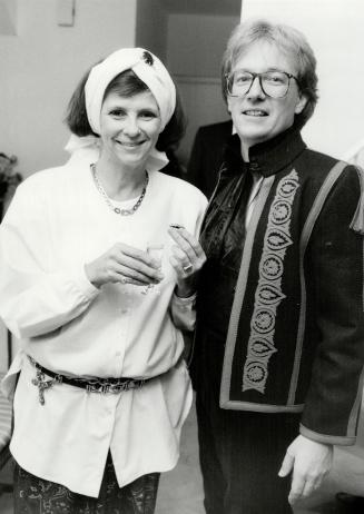 Below, Toronto designer Marilyn Brooks in jewelled turban and peasant shirt with husband Kennedy Coles in appliqued folkloric-chic jacket