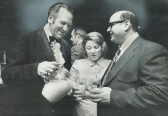 Syd Brown pours for molly and Albert Nightingale