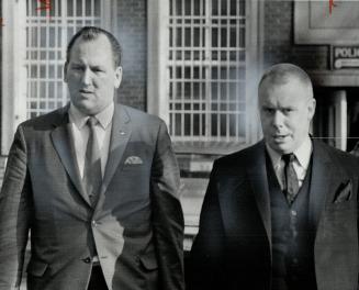Syd Brown, left, of Toronto Police Association, leaves police headquarters with lawyer John Kerr after the two had sat in on inquiry into charges that(...)