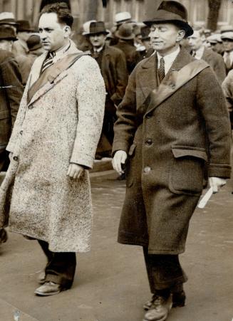 Tim Buck, Communist leader, walking at the head of the long parade