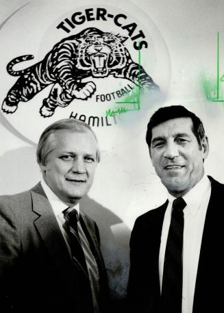 New tamer: General manager Joe Zuger, left, introduces new Hamilton Tiger-Cat coach, former Argo pass-catcher Al Bruno, following unexpected firing of head coach Bud Riley yesterday