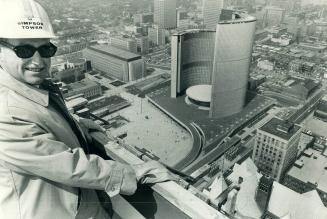 'Topped off' with a bang. Fireworks and a golden bucket of cement were part of the celebrations today marking the completion of a new Toronto landmark(...)